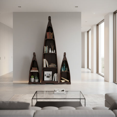 Set of three handcrafted canoe-shaped display shelves in a dark stained wood finish, styled with books, plants, bottles, and decorative accessories to create a striking focal point in a contemporary living space.