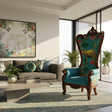 Luxury high-back wingback accent chair featuring a hand-carved dark wood frame, vibrant teal upholstery with an elephant and tropical botanical print, rolled arms, and ornate carved detailing. A bold statement chair for eclectic, luxury, and safari-inspired interiors.