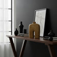 Sculptural stoneware vase with a warm earthy finish, featuring a minimalist arched silhouette, narrow neck, and textured handcrafted surface. A contemporary decorative vase that brings organic warmth and modern elegance to shelves, console tables, coffee tables, or styled interiors.