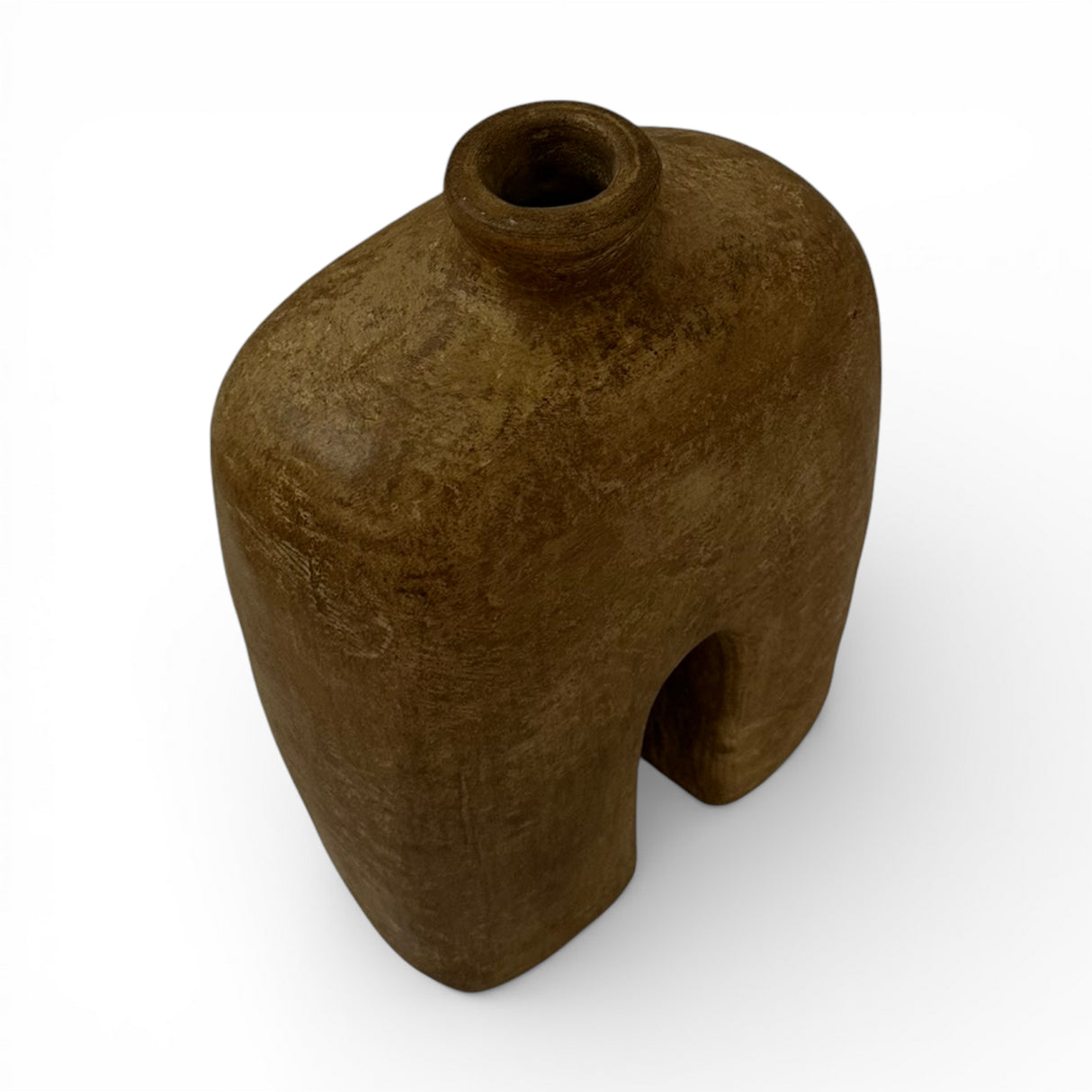 Sculptural stoneware vase with a rich earthy brown finish, featuring a minimalist arched silhouette, rounded shoulders, a narrow neck, and a textured handcrafted surface. An elegant decorative vase that brings warmth, organic character, and contemporary style to shelves, console tables, coffee tables, or styled interiors.
