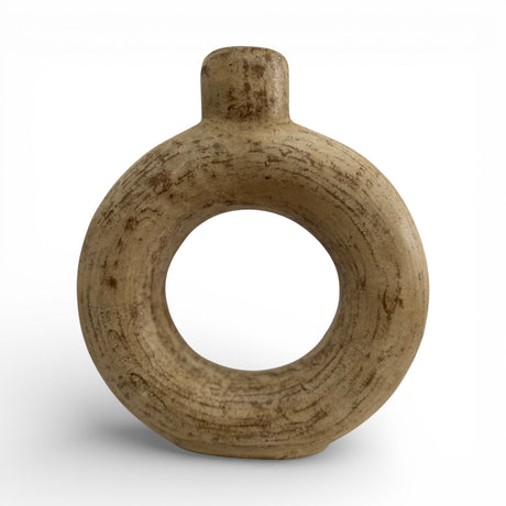 Sculptural stoneware vase with a warm natural finish, featuring a circular cut-out centre, rounded halo silhouette, and short cylindrical neck. A handcrafted contemporary decorative vase that adds organic texture and modern elegance to shelves, console tables, coffee tables, or styled interiors.