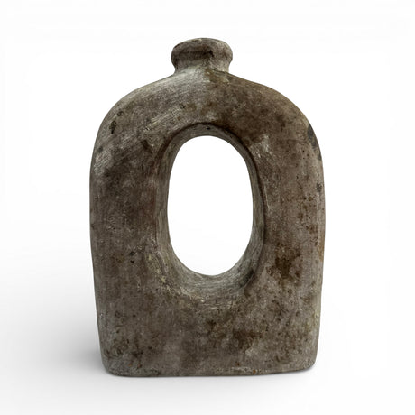 Sculptural stoneware vase with a weathered grey finish, featuring a minimalist rounded silhouette, large oval cut-out centre, and short cylindrical neck. A contemporary decorative vase that adds organic texture and artistic elegance to shelves, console tables, coffee tables, or modern interiors.