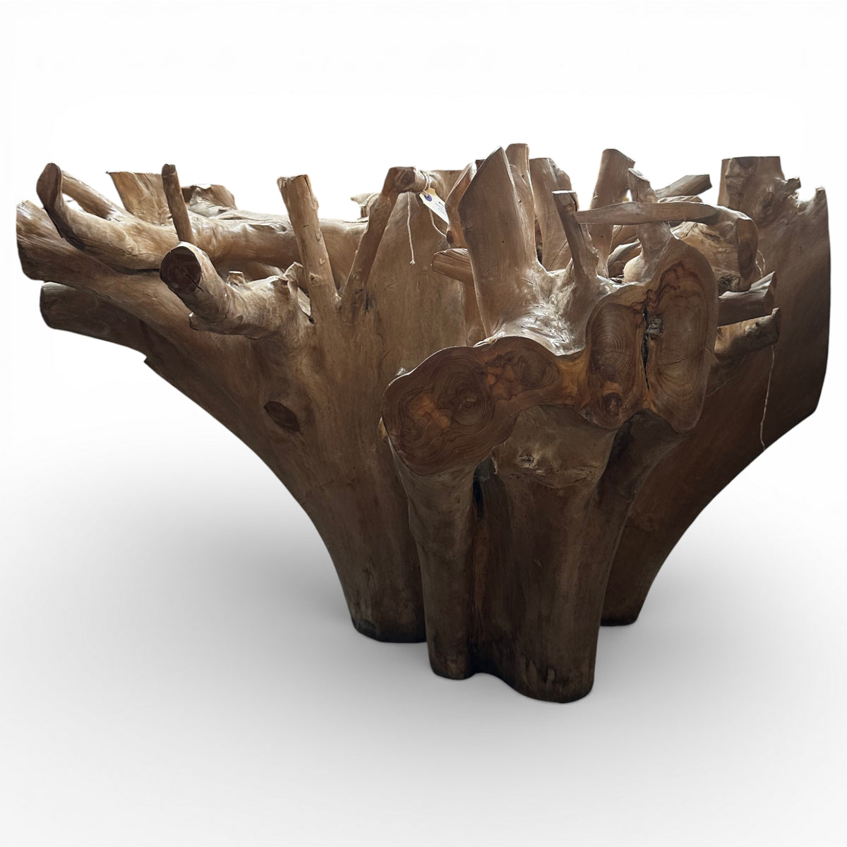 Handcrafted sculptural table base carved from solid natural teak root, showcasing organic curves, exposed grain, and unique root formations. Designed as a striking foundation for a custom glass tabletop, this one-of-a-kind piece is ideal for luxury homes, boutique hotels, lodges, or contemporary nature-inspired interiors.