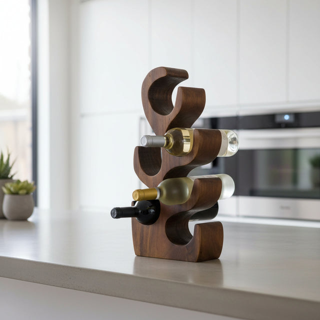 Sculptural handcrafted teak wood wine rack with six curved bottle holders, styled with wine bottles on a modern kitchen countertop. Featuring a rich natural wood finish, this contemporary wine rack offers elegant storage and serves as a striking decorative accent for kitchens, dining rooms, or home bars.