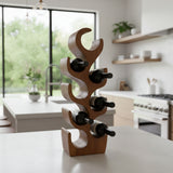 Sculptural handcrafted teak wood wine rack with six curved bottle holders, styled with wine bottles on a modern kitchen countertop. Featuring a rich natural wood finish, this contemporary wine rack offers elegant storage and serves as a striking decorative accent for kitchens, dining rooms, or home bars.