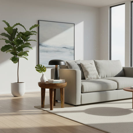 Handcrafted round accent side table made from solid natural wood, featuring a smooth circular top, tapered legs, and a warm timber finish. A timeless and versatile piece perfect for living rooms, bedrooms, reading nooks, boutique hotels, or contemporary interiors.
