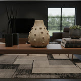 Textured stoneware bobble vase in a natural sand finish, styled on a wooden console table in a contemporary living room. Featuring a rounded silhouette, raised bobble detailing, and an organic handcrafted look, this sculptural vase adds warmth and texture to modern interiors.