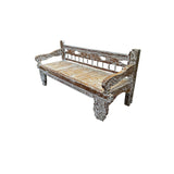 Handcrafted vintage carved wooden daybed featuring a distressed solid wood frame with ornate hand-carved legs, rolled arms, and a woven natural fiber seat, displayed on a white background.