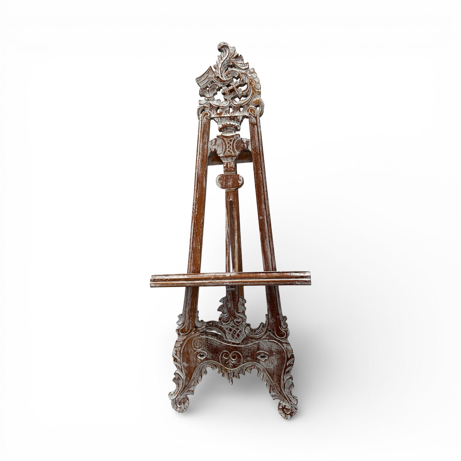 Vintage hand-carved wooden display easel featuring an ornate traditional design with intricate scrollwork and a distressed dark wood finish. Perfect for displaying artwork, framed prints, mirrors, welcome signs, menus, or decorative pieces in homes, galleries, boutique hotels, weddings, and event spaces.