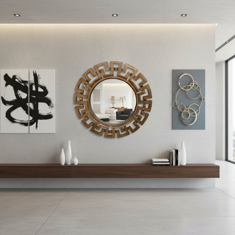 Round walnut-finish geometric wall mirror with a bold Greek key-inspired frame, styled above a floating wooden console in a contemporary living room with modern wall art and minimalist décor.
