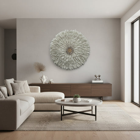 Modern living room with a decorative wall piece, sofa, and coffee table.