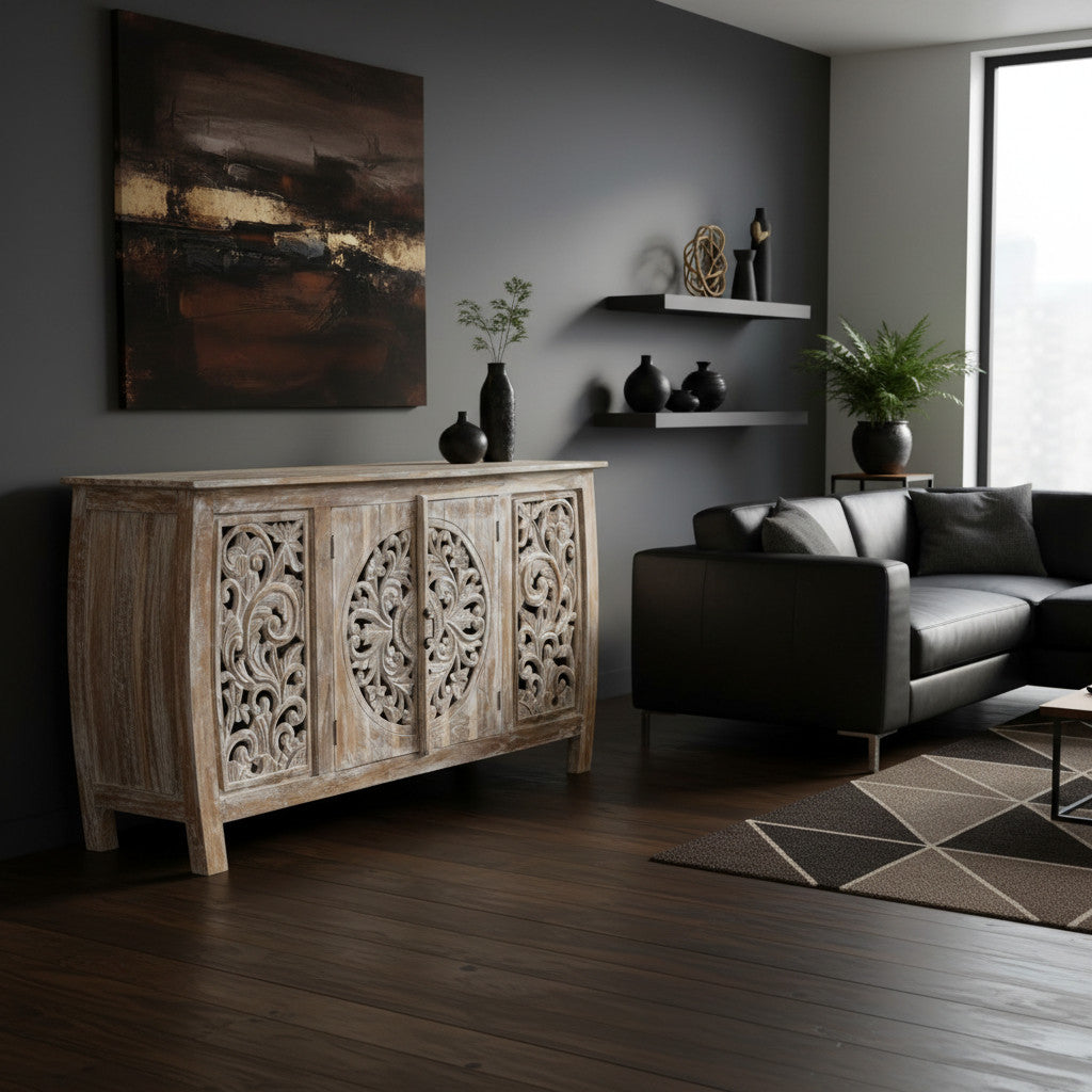 Elegant whitewashed wooden sideboard featuring four intricately carved cabinet doors with floral and medallion detailing, perfect for sophisticated interiors.