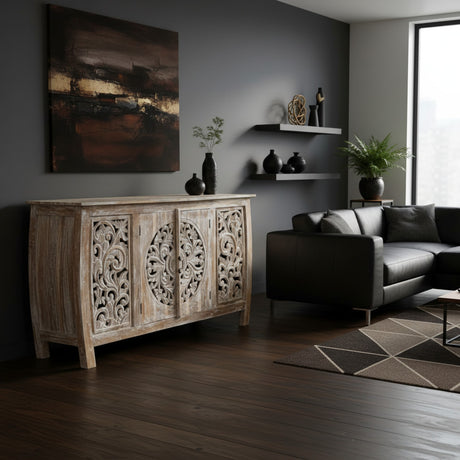 Elegant whitewashed wooden sideboard featuring four intricately carved cabinet doors with floral and medallion detailing, perfect for sophisticated interiors.