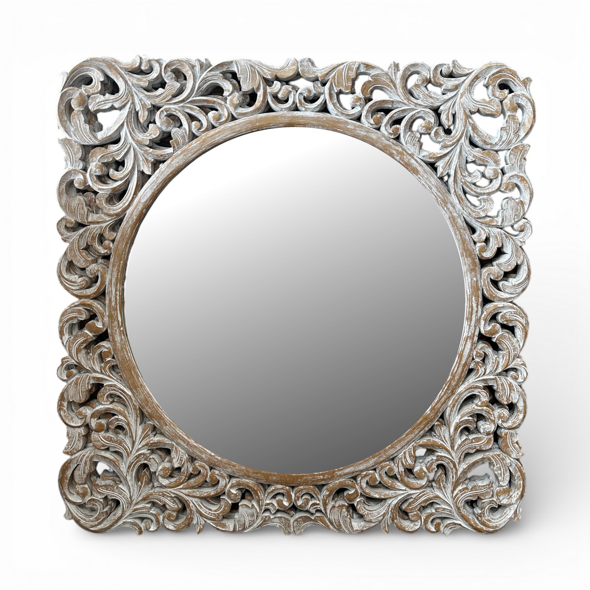 Whitewashed ornate carved wooden wall mirror featuring an intricately hand-carved botanical frame with a distressed natural finish and round mirror centre. This elegant statement mirror adds timeless sophistication to entryways, living rooms, bedrooms, and hallways while complementing coastal, farmhouse, French country, traditional, and luxury interiors.