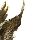 Close-up of an antique gold eagle wing bookend showcasing intricately sculpted feather detailing and a distressed metallic finish, highlighting its bold craftsmanship and classic decorative appeal.