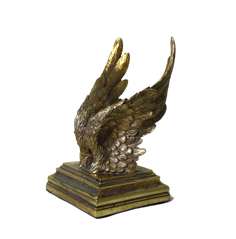 Decorative antique gold eagle wing bookends with intricately sculpted feather detailing and stepped bases, ideal for displaying books while adding a bold, classic statement to shelves or desks.