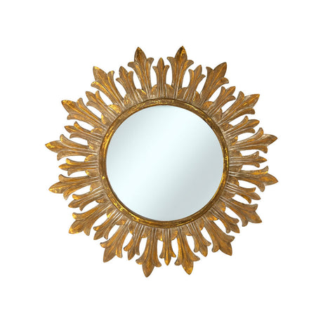 Decorative round wall mirror with an antique gold fleur-inspired sunburst frame featuring elegant leaf-shaped rays and a distressed metallic finish, perfect for adding timeless luxury to any interior.