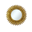 Round wall mirror with an antique gold reed-style sunburst frame featuring evenly spaced textured rays and a distressed metallic finish, adding timeless elegance to any room.