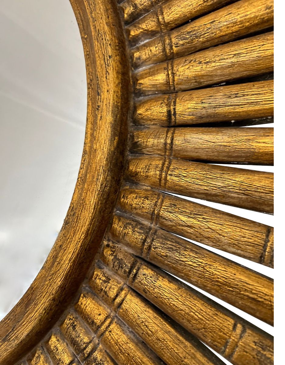 Close-up of an antique gold sunburst wall mirror showcasing the textured metallic finish, handcrafted radiating rays, and elegant vintage-inspired detailing.