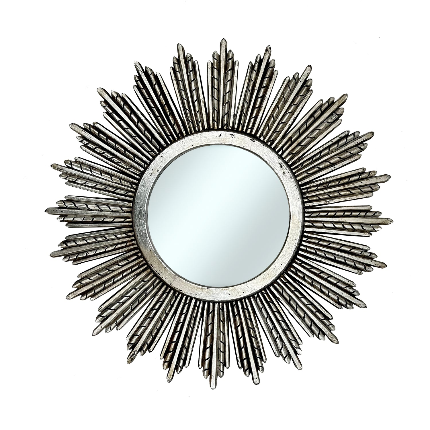 Decorative round wall mirror with an antique silver radiating sunburst frame featuring long textured rays and a distressed metallic finish, creating an elegant statement for classic and contemporary interiors.