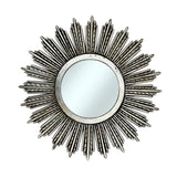 Decorative round wall mirror with an antique silver radiating sunburst frame featuring long textured rays and a distressed metallic finish, creating an elegant statement for classic and contemporary interiors.