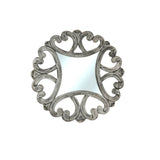 Decorative wall mirror with an antique silver frame featuring elegant open scrollwork and a distressed metallic finish, bringing timeless sophistication to classic and contemporary interiors.