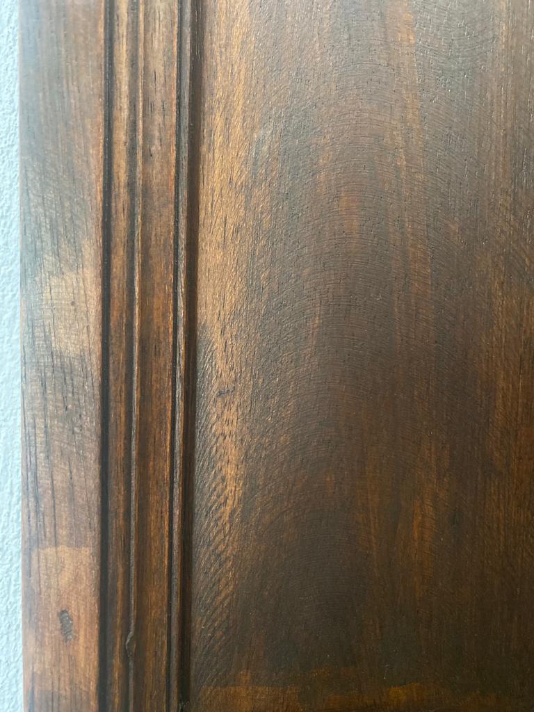 Close-up of a dark walnut wood frame featuring a rich brown finish, visible natural wood grain, and subtle distressed detailing for a timeless, handcrafted look.
