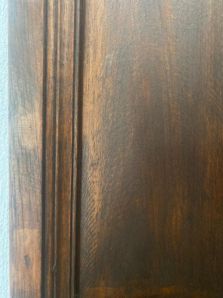 Close-up of a dark walnut wood frame featuring a rich brown finish, visible natural wood grain, and subtle distressed detailing for a timeless, handcrafted look.