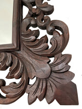 Elegant hand-carved wooden wall mirror featuring intricate Baroque-inspired floral and scroll detailing in a rich dark wood finish, perfect for classic, traditional, and luxury interiors.