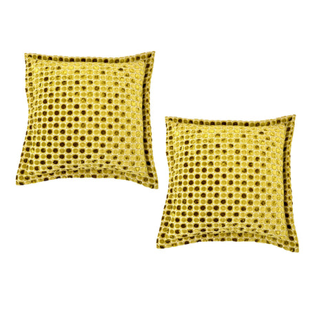 Set of two luxury square velvet scatter cushions featuring a textured mustard gold honeycomb pattern with a soft plush finish, perfect for adding warmth and contemporary elegance to sofas, armchairs, or beds.