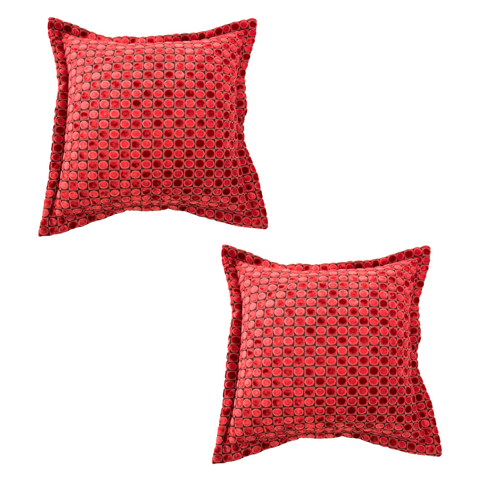 Set of two luxury square velvet scatter cushions featuring a textured ruby red honeycomb pattern with a soft plush finish, perfect for adding bold colour and contemporary elegance to sofas, armchairs, or beds.