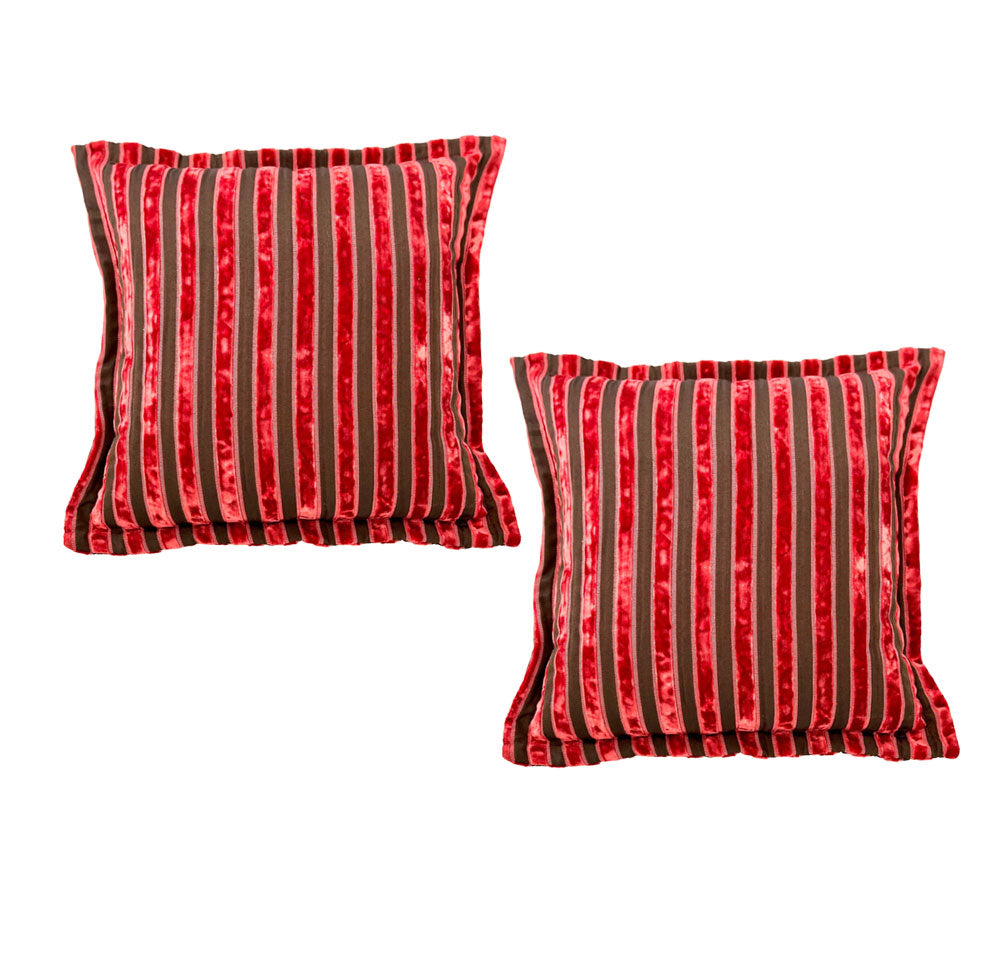 Set of two luxury square velvet scatter cushions featuring bold ruby red and blush pink vertical stripes with a soft textured finish, perfect for adding warmth and contemporary elegance to sofas, armchairs, or beds.