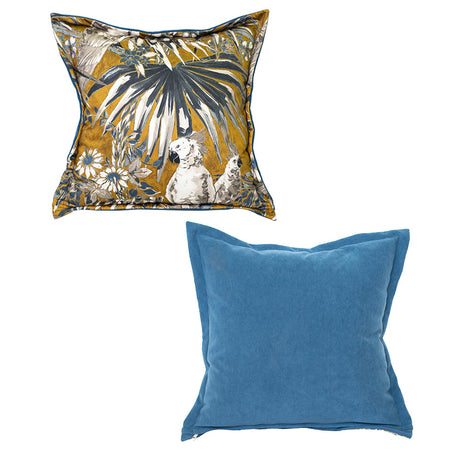 Set of two luxury scatter cushions featuring a tropical botanical and bird print in mustard gold, blue, cream, and charcoal, paired with a plain soft blue velvet cushion for a sophisticated contemporary look.